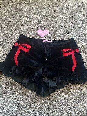 Sugar Thrillz Black Velvet Ruffle Shorts with Red Bow Accents